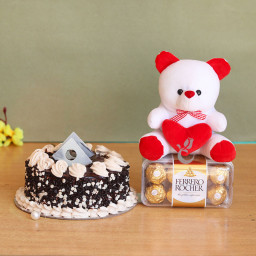 The Song of Love: A Gift Combo of 0.5 Kg Chocolate Cake, 16 Ferrero Rocher, and 6 Inch Teddy The Song of Love: A Gift Combo of 0.5 Kg Chocolate Cake, 16 Ferrero Rocher, and 6 Inch Teddy