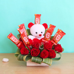 Cuteness Defined: A Gift Combo of Box Arrangement, 10 KitKat, 10 Red Roses, and 6 Inch Teddy Cuteness Defined: A Gift Combo of Box Arrangement, 10 KitKat, 10 Red Roses, and 6 Inch Teddy