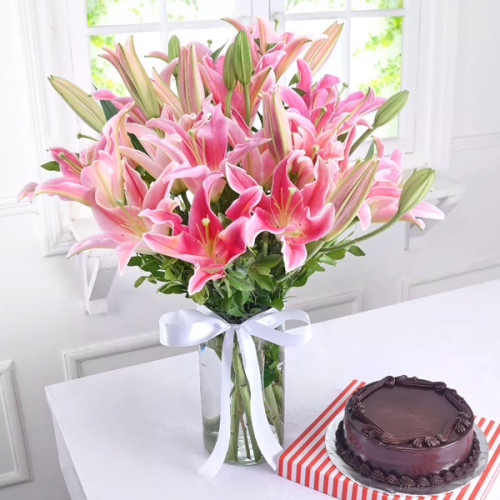 Perfect Day With Lilies: A Gift Combo of 6 Pink Lily in a Glass Vase and 0.5 Kg Chocolate Cake