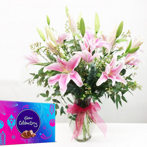 Special Surprise Arrangement: A Gift Combo of 7 Pink Lily with Vase Arrangement and One Celebration
