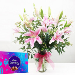 Special Surprise Arrangement: A Gift Combo of 7 Pink Lily with Vase Arrangement and One Celebration Special Surprise Arrangement: A Gift Combo of 7 Pink Lily with Vase Arrangement and One Celebration