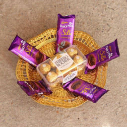 Chocolicious Delight: A Gift Combo of 16 pcs Ferrero Rocher and 5 Dairy Milk Silk in basket Chocolicious Delight: A Gift Combo of 16 pcs Ferrero Rocher and 5 Dairy Milk Silk in basket