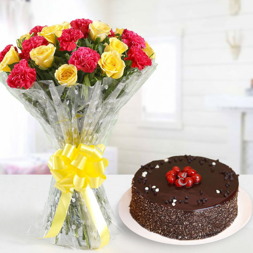 Exquisite Hamper: A Gift Combo of 10 Red Carnation, 10 Yellow Roses, and 0.5 Kg Chocolate Cake