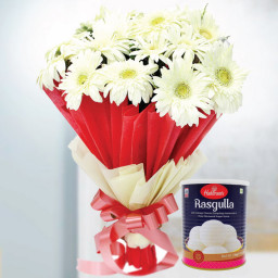 Epitome Of Soothness: A Gift Combo of 12 White Gerbera and 1 Kg Rasgulla Epitome Of Soothness: A Gift Combo of 12 White Gerbera and 1 Kg Rasgulla