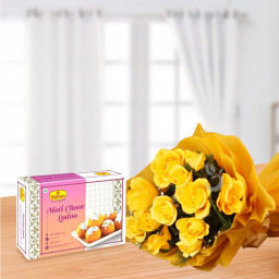 Coupled In Yellow: A Gift Combo of 12 Yellow Roses and 500 gm Besan Ladoo. Coupled In Yellow: A Gift Combo of 12 Yellow Roses and 500 gm Besan Ladoo.