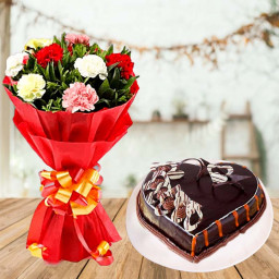 Lavishly Exuberant: A Gift Combo of 10 Mixed Carnations and 0.5 kg Chocolate Cake Lavishly Exuberant: A Gift Combo of 10 Mixed Carnations and 0.5 kg Chocolate Cake