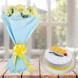 Creamy Creation: A Gift Combo of 10 Yellow Carnations and 0.5 kg Pineapple Cream Cake Creamy Creation: A Gift Combo of 10 Yellow Carnations and 0.5 kg Pineapple Cream Cake