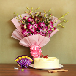 Royal Celebrations: A Gift Combo of 6 purple orchids, 0.5 kg butterscotch cake and 5 Dairy Milk Royal Celebrations: A Gift Combo of 6 purple orchids, 0.5 kg butterscotch cake and 5 Dairy Milk