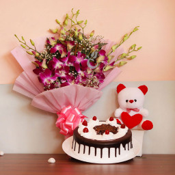 Chocolaty Pink orchid: A Gift Combo of 6 purple orchids, 0.5 kg Black Forest cake and 6 inch teddy bear Chocolaty Pink orchid: A Gift Combo of 6 purple orchids, 0.5 kg Black Forest cake and 6 inch teddy bear