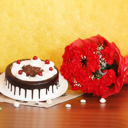 Symbol Of Love: A Gift Combo of 12 red carnations and 0.5 kg Black Forest cake Symbol Of Love: A Gift Combo of 12 red carnations and 0.5 kg Black Forest cake