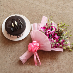 World to Me: A Gift Combo of 10 purple orchids and 0.5 kg chocolate cake World to Me: A Gift Combo of 10 purple orchids and 0.5 kg chocolate cake