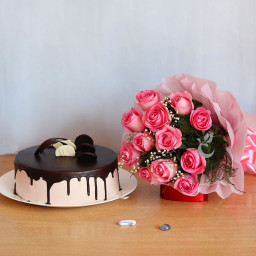 Innocent Expressions: A Gift Combo of 10 pink roses and 0.5 kg chocolate truffle cake Innocent Expressions: A Gift Combo of 10 pink roses and 0.5 kg chocolate truffle cake