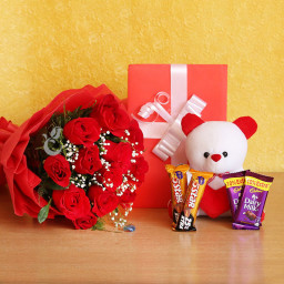 Huge Combo: A Gift Combo of 10 red roses, 2 Cadbury Dairy Milk, 2 Five Star chocolates, greeting card and white teddy Huge Combo: A Gift Combo of 10 red roses, 2 Cadbury Dairy Milk, 2 Five Star chocolates, greeting card and white teddy