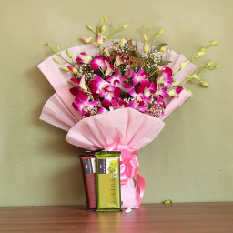 Sweet Treasure: A Gift Combo of 6 purple orchids and 2 Cadbury Temptations Sweet Treasure: A Gift Combo of 6 purple orchids and 2 Cadbury Temptations