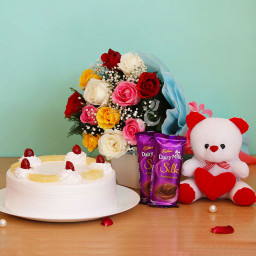 Cute Hug: A Gift Combo of 12 Mix Roses, 6 Inch Teddy, 2 Dairy Milk Silk and 0.5 Kg Pineapple Cake Cute Hug: A Gift Combo of 12 Mix Roses, 6 Inch Teddy, 2 Dairy Milk Silk and 0.5 Kg Pineapple Cake