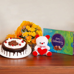 Celebrating Emotions: A Gift Combo of 12 Yellow Roses, 0.5 Kg Blackforest Cake, 6 Inch Teddy and 1 Celebration Celebrating Emotions: A Gift Combo of 12 Yellow Roses, 0.5 Kg Blackforest Cake, 6 Inch Teddy and 1 Celebration