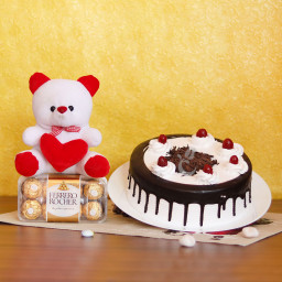 Fabulous Fascination: A Gift Combo of 6 Inch Teddy, 0.5 Kg Black Forest Cake and 16 Ferrero Rocher Fabulous Fascination: A Gift Combo of 6 Inch Teddy, 0.5 Kg Black Forest Cake and 16 Ferrero Rocher
