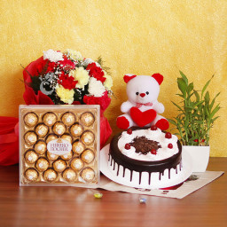 Lucky Combo: A Gift Combo of 12 Mix Carnations, 0.5 Kg Black Forest Cake, Lucky Bamboo, 6 Inch Teddy and 24 Ferrero Rocher Lucky Combo: A Gift Combo of 12 Mix Carnations, 0.5 Kg Black Forest Cake, Lucky Bamboo, 6 Inch Teddy and 24 Ferrero Rocher