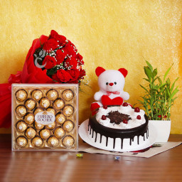 Red Rush: A Gift Combo of 12 Red Roses, 0.5 Kg Black Forest Cake, Lucky Bamboo, 24 Ferrero Rocher and 6 Inch Teddy Red Rush: A Gift Combo of 12 Red Roses, 0.5 Kg Black Forest Cake, Lucky Bamboo, 24 Ferrero Rocher and 6 Inch Teddy