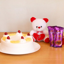 Truly Yours: A Gift Combo of 2 Dairy Milk Silk, 0.5 Kg Pineapple Cake and 6 Inch Teddy Truly Yours: A Gift Combo of 2 Dairy Milk Silk, 0.5 Kg Pineapple Cake and 6 Inch Teddy