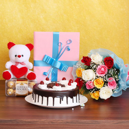 Joy to the World: A Gift Combo of 6 Inch Teddy, 0.5 Kg Black Forest Cake, 12 Mix Roses, Greeting Card and 16 Ferrero Rocher Chocolates Joy to the World: A Gift Combo of 6 Inch Teddy, 0.5 Kg Black Forest Cake, 12 Mix Roses, Greeting Card and 16 Ferrero Rocher Chocolates