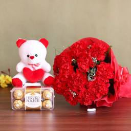 Love Syllable: A Gift Combo of 12 Carnations, 6 Inch Teddy and 16 Ferrero Rocher Love Syllable: A Gift Combo of 12 Carnations, 6 Inch Teddy and 16 Ferrero Rocher