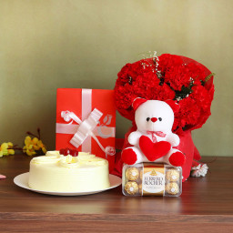 Love Extravaganza: A Gift Combo of 12 Carnation,  6 Inch Teddy, One Greeting Card, 16 Ferrero Rocher, 0.5 Kg Butterscotch