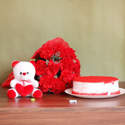 Colour of Love: A Gift Combo of 12 Red Carnations, 6 Inch Teddy, and 0.5 Kg Red Velvet Cake Colour of Love: A Gift Combo of 12 Red Carnations, 6 Inch Teddy, and 0.5 Kg Red Velvet Cake